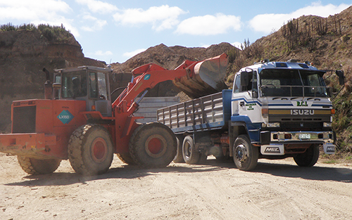 Truck Being Loaded with Metal